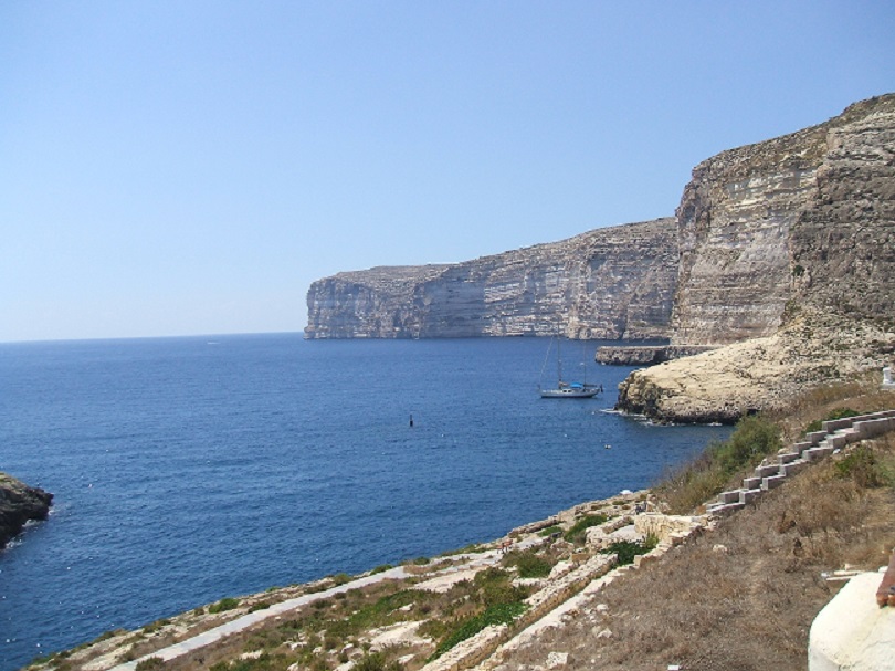 Majestic cliffs line Gozo's coastline.